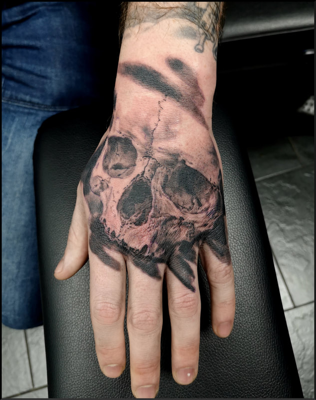 Hand tattoo, skull tattoo, skull on hand, black and grey tattoo, Jolene Sherrard, tattoo,
